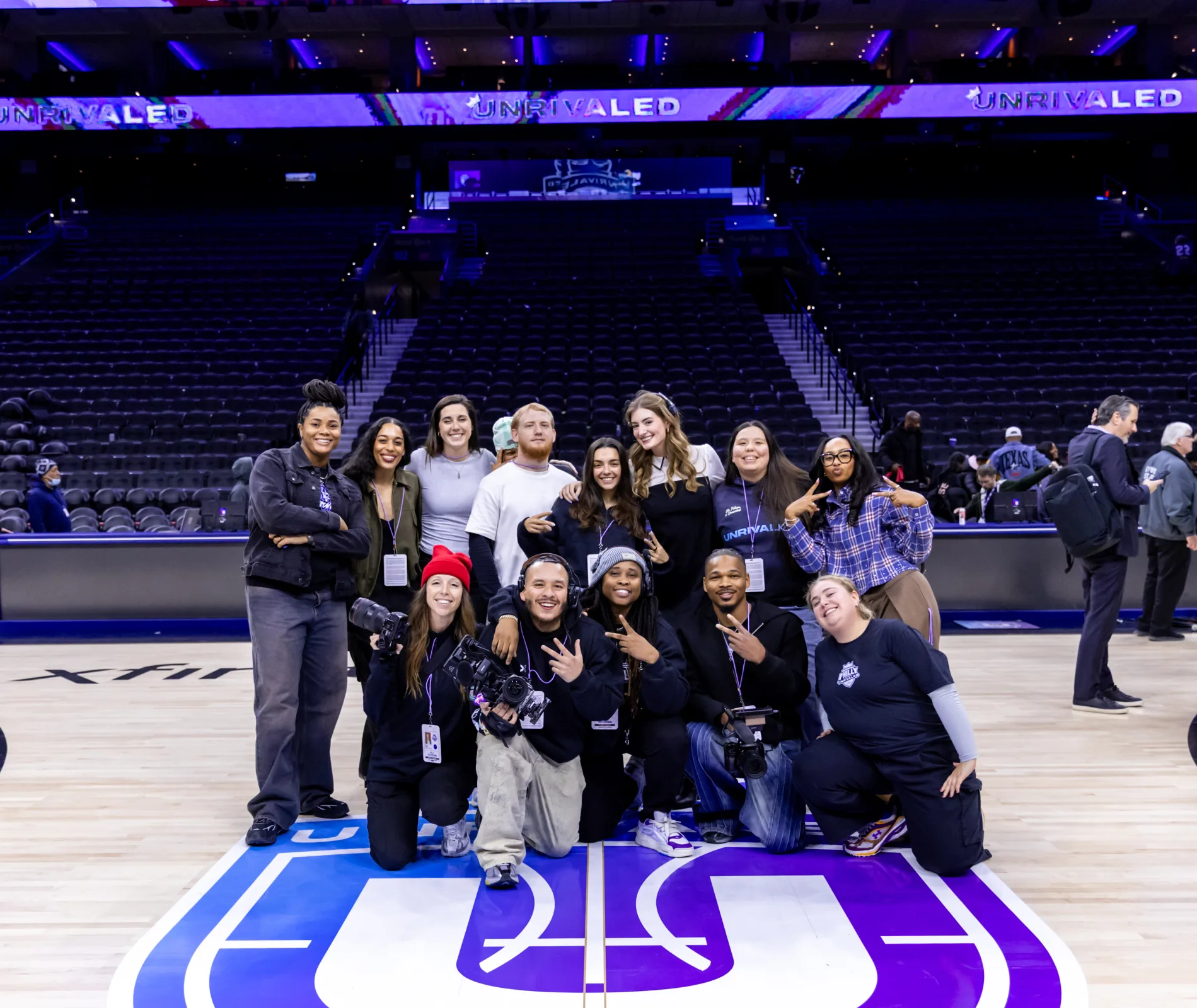 Camilla Flefil filming courtside at an Unrivaled Basketball event