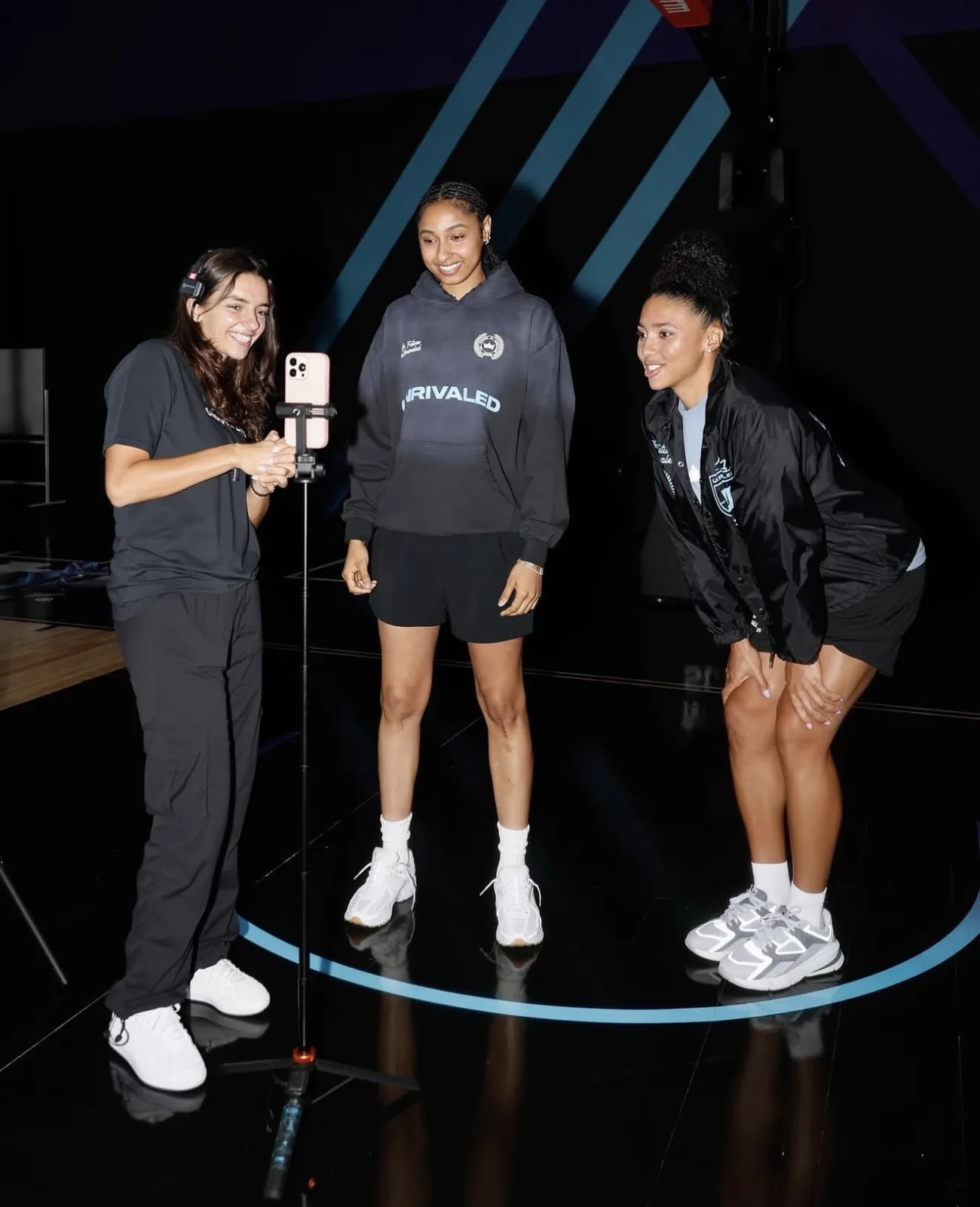 Camilla Flefil filming WNBA players with a phone gimbal at Unrivaled Basketball